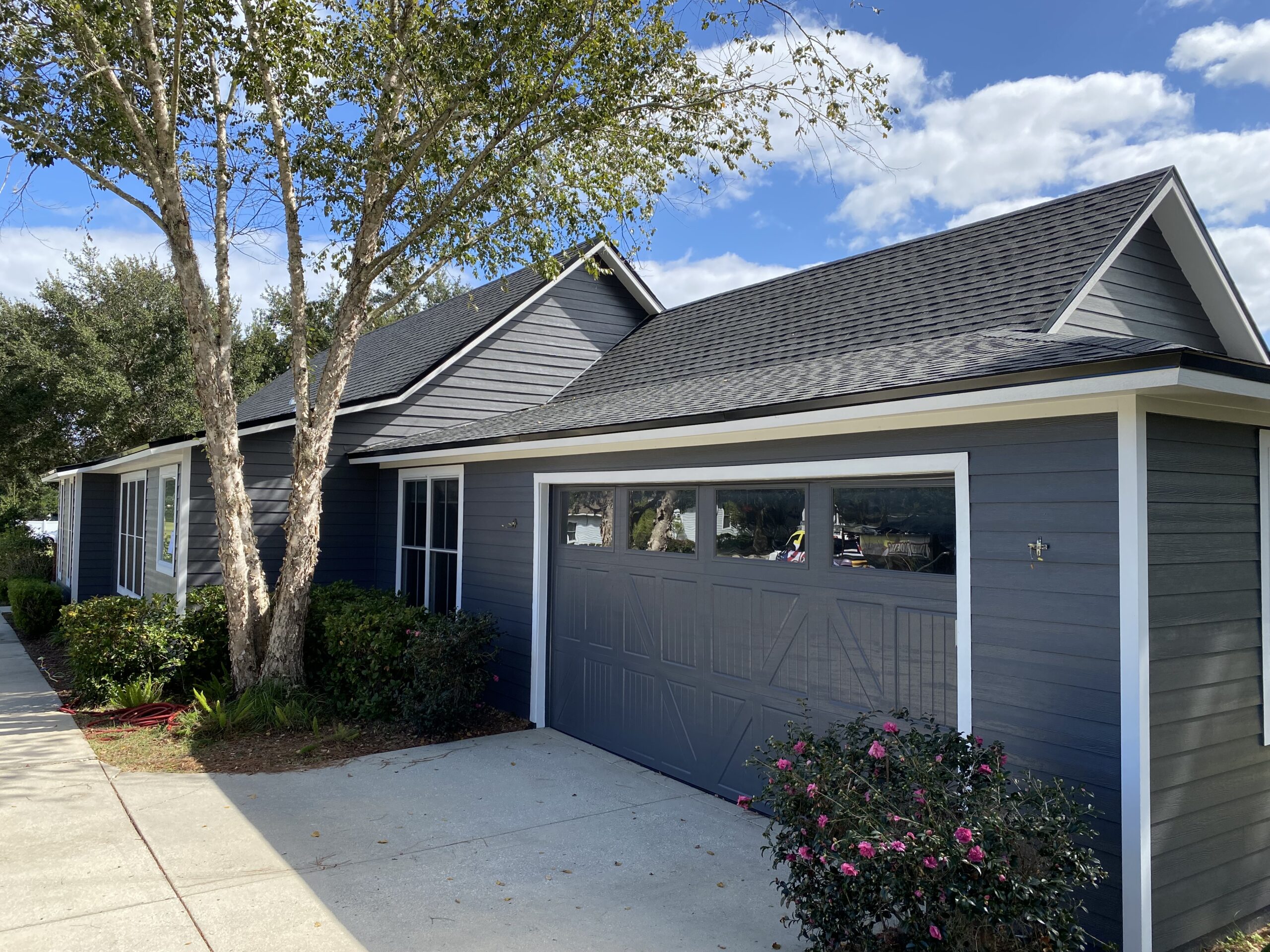 United Roofing restoring a damaged roof with professionalism in Ocala, FL, Master roofing contractor from United Roofing consulting with a Groveland homeowner about customized roofing solutions