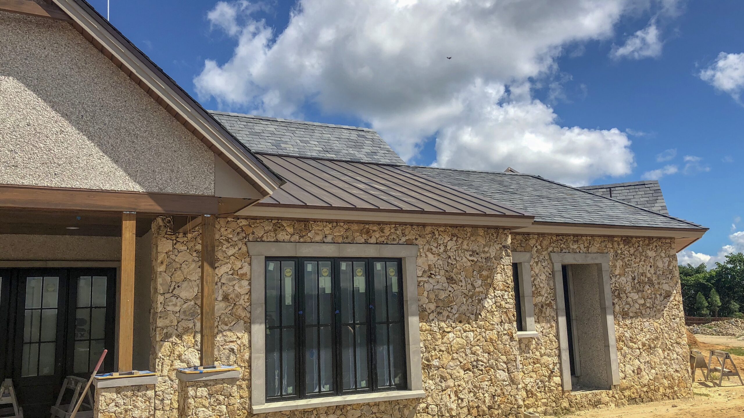 United Roofing team expertly installing a commercial roof in Ocala, FL, Roofer repairing damaged shingles on Florida home after wind-driven rain